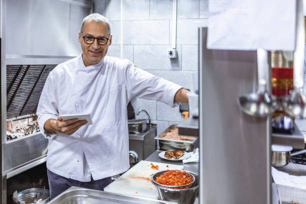 istock Business owner checking kitchen supplies 1304380101