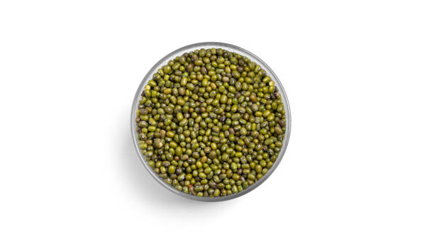 istock Dry green beans in a glass jar isolated on a white background 1304380638