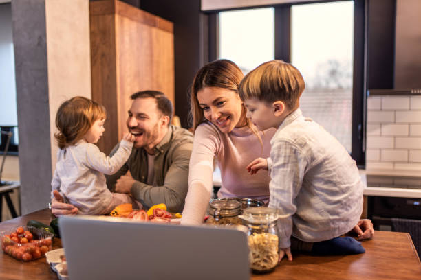 istock Happy family preparing lunch in the kitchen. 1304381774