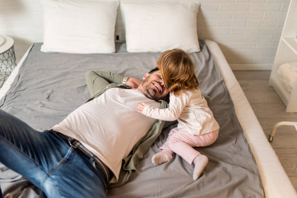 istock Father and daughter relaxing at home. 1304382920