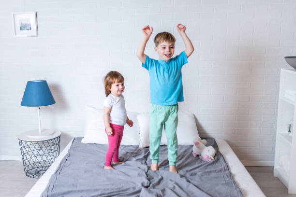 istock Little brother and sister having fun at home. 1304383217