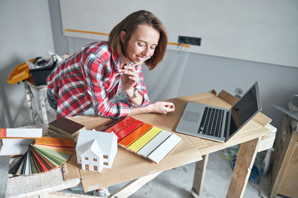 istock Pleased interior designer examining the colored fiberboard sample kit 1304387065