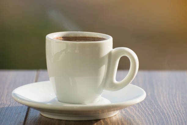 A cup of aromatic espresso coffee on a table in a cafe. Soft background.