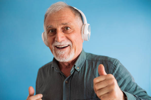 istock Senior man is enjoying in the music 1304388051