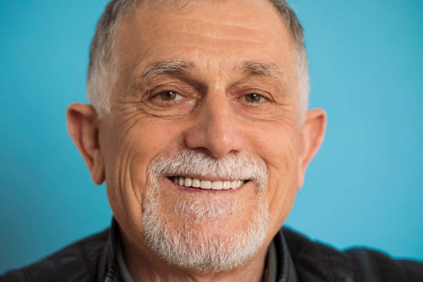 istock Handsome senior man with beautiful smile 1304389061