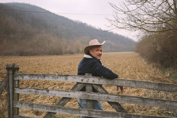 istock Handsome adult farmer wearing cowboy hat 1304391505