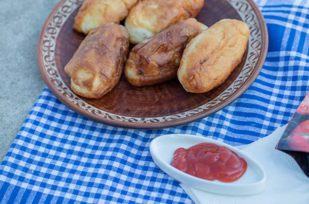 Homemade pastries with ketchup on a tablecloth. High quality photo