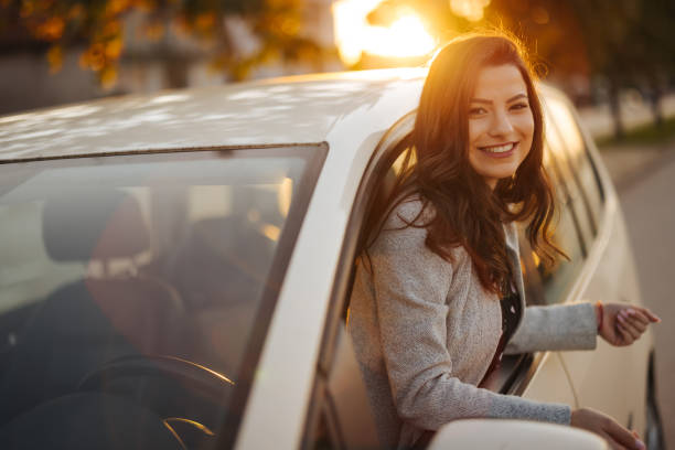 istock Young woman looking out the car window 1304401319