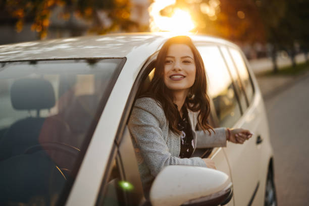 istock Young woman looking out the car window 1304402145