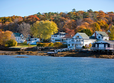 Beautiful New England colonial style homes on the water in fall