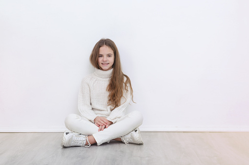 Headshot portrait of happy little girl posing