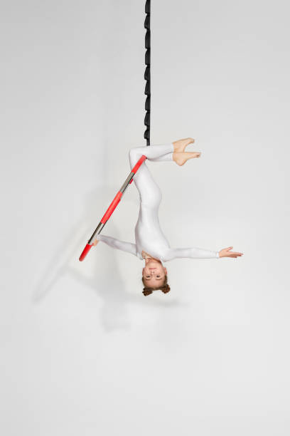 istock Girl gymnast shows an acrobatic performance 1304409087