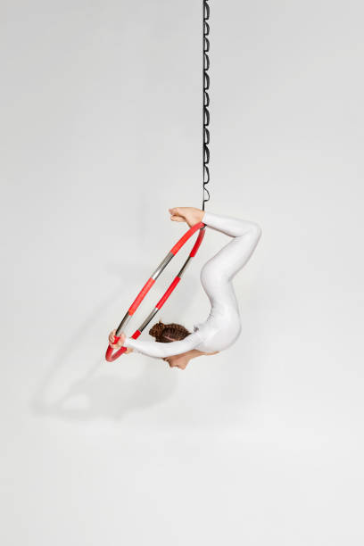 istock Girl gymnast shows an acrobatic performance 1304409112