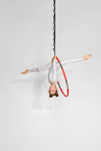 istock Girl gymnast shows an acrobatic performance 1304409121