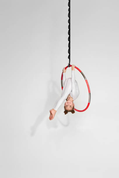 istock Girl gymnast shows an acrobatic performance 1304409137