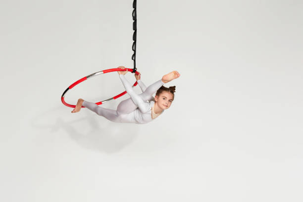 istock Girl gymnast shows an acrobatic performance 1304409144