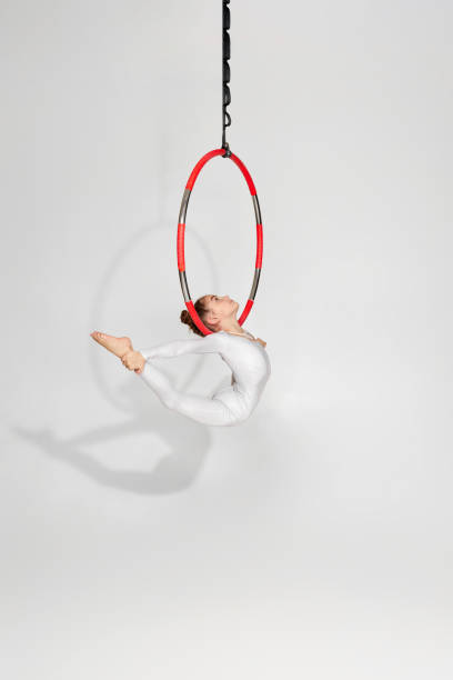 istock Girl gymnast shows an acrobatic performance 1304409151