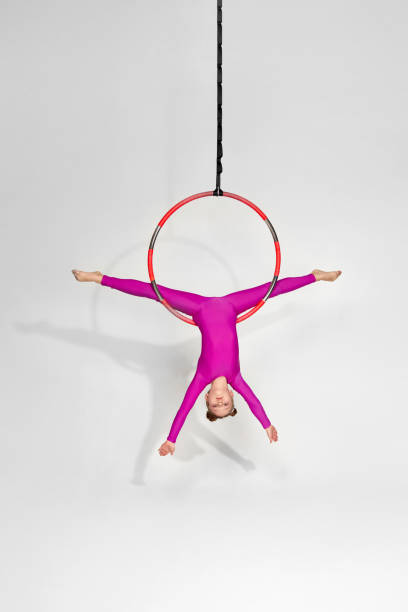 istock Girl gymnast shows an acrobatic performance 1304409200