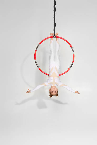 istock Girl gymnast shows an acrobatic performance 1304409376