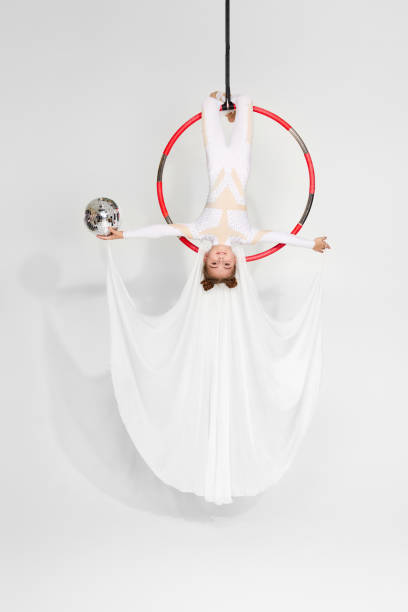 istock Girl gymnast shows an acrobatic performance 1304409394