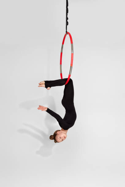 istock Girl gymnast shows an acrobatic performance 1304409436