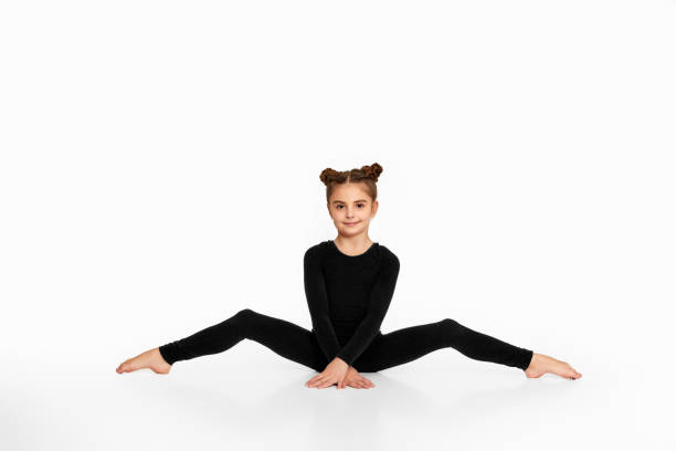 istock child girl sitting on a transverse twine. 1304410118