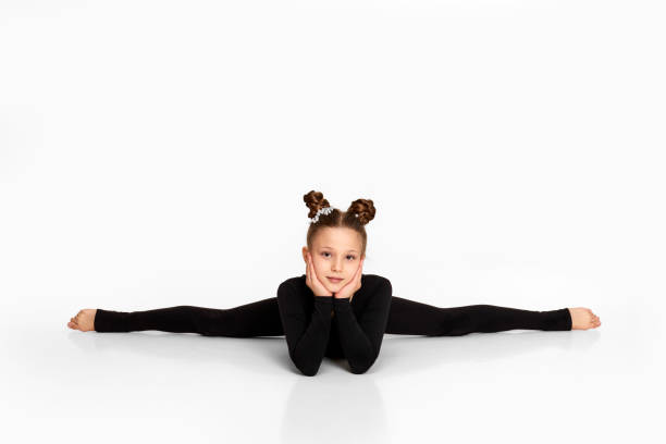istock child girl sitting on a transverse twine. 1304410164
