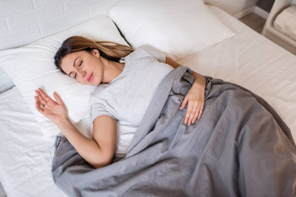 istock Woman sleeping at home. 1304410332