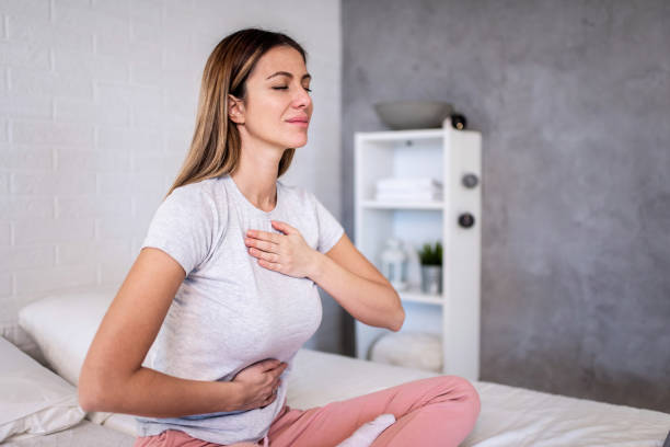 istock Woman meditating in the bedroom. 1304411482