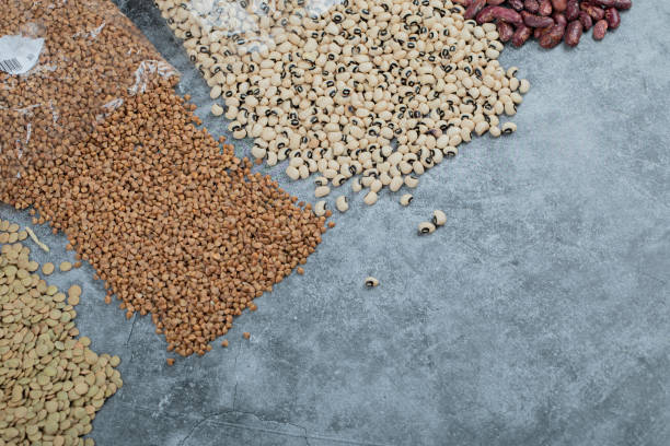 istock Different kinds of beans packed on a gray background 1304415573