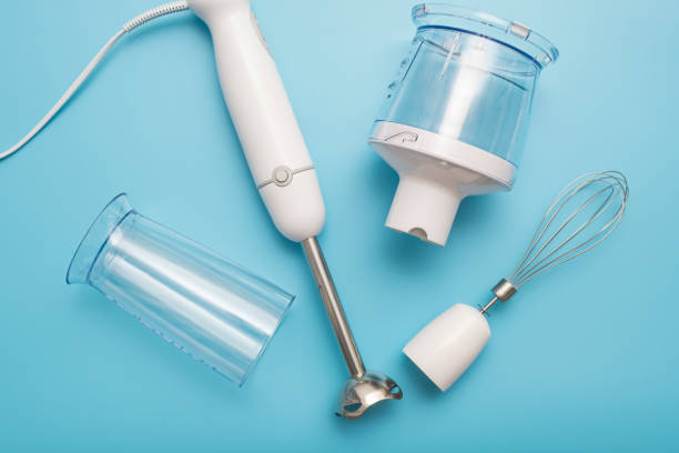 istock Electric hand mixer. Modern electric kitchen appliances for making sauces, smoothies, puree. Hand mixer set. 1304415689