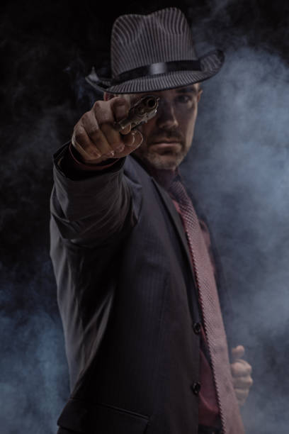 istock Elegant handsome gangster detective man in studio shot 1304416358