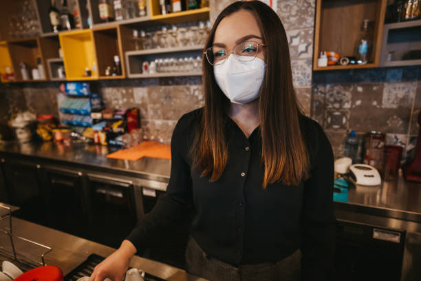 istock Young woman working in coffee shop 1304416457