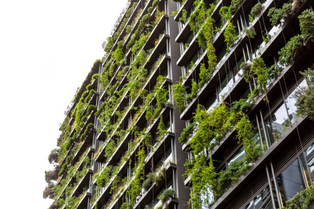istock Low angle view of appartment building with vertical gardens, sky background with copy space 1304418312