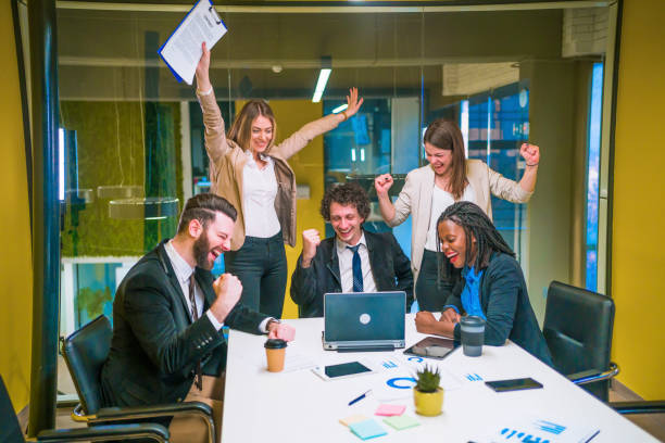 istock Business team employees celebrating success 1304421311