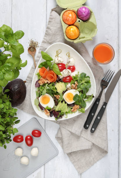 istock Healthy Salad bowl with eggs tomatoes and avocado 1304421479