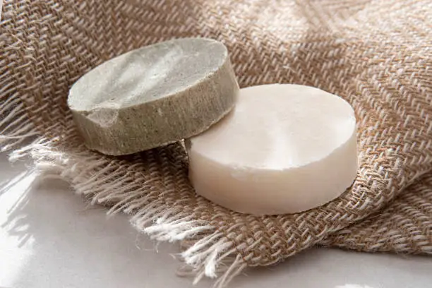 Spotlight on ecological homemade soaps and solid shampoo in the bathroom