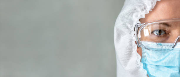 istock Doctor or nurse in PPE suit and background for text 1304425104
