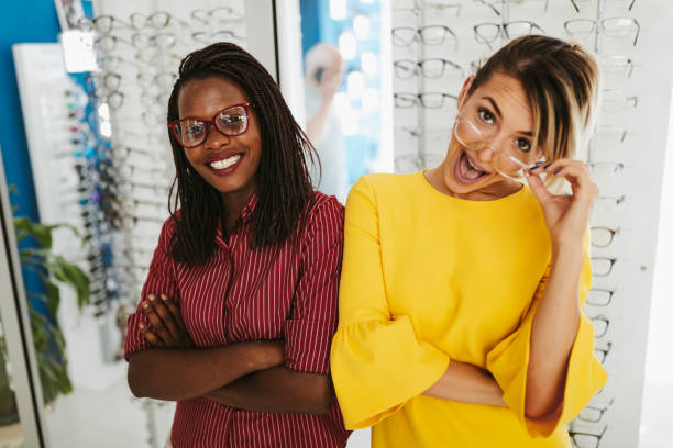istock Female opticians at the optical shop 1304427295