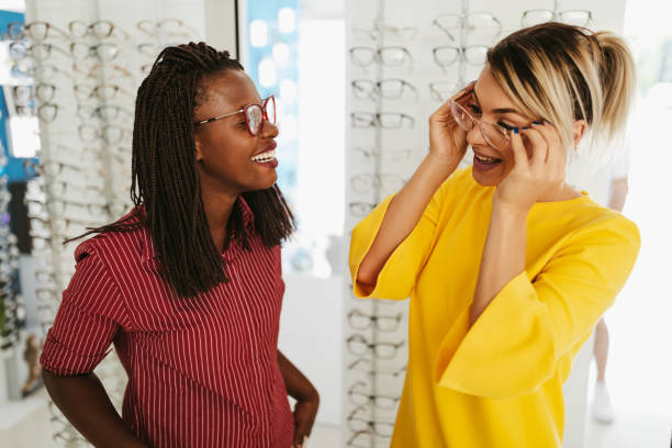 istock Optometrist helping client to choose eyeglasses 1304427580