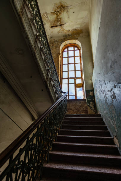 istock Old vintage staircase at the old abandoned building 1304429111