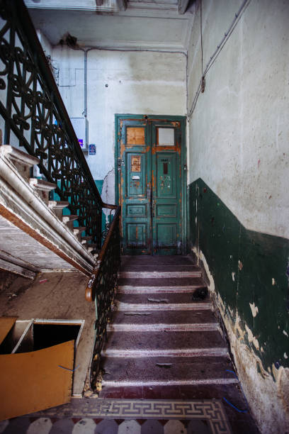 istock Old vintage staircase at the old abandoned building 1304429113