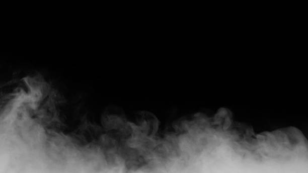 istock White smoke or fog isolated on black background. 1304432820