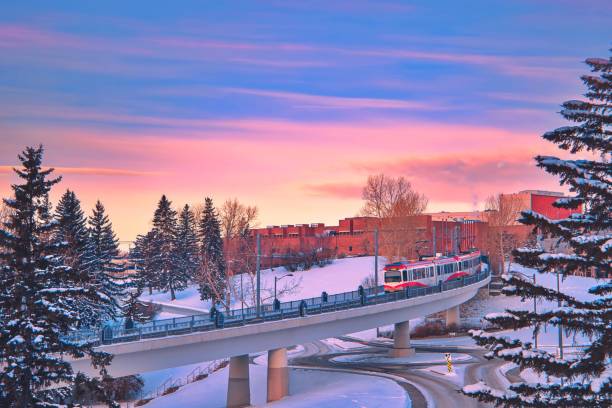 City Train Crossing The Track At Sunrise