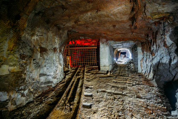 istock Dark and dirty abandoned uranium mine tunnel 1304434715