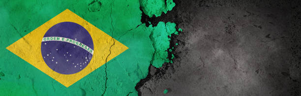istock Brazil flag on a rough background. Broken and cracked background. 1304435721