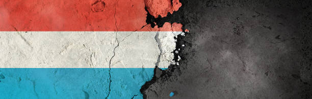 istock Luxembourg flag on a rough background. Broken and cracked background. 1304435878