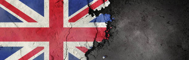 istock U.K. flag on a rough background. Broken and cracked background. 1304435920