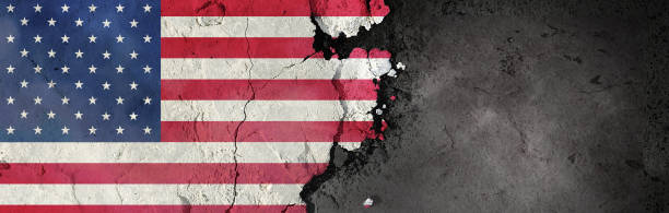 istock United States flag on a rough background. Broken and cracked background. 1304436442