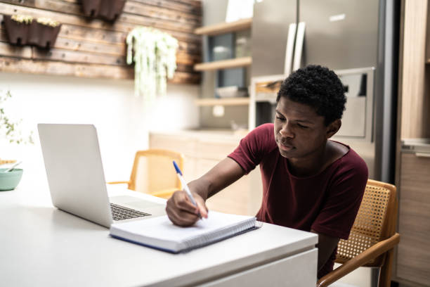 istock Teenager boy on homeschooling using laptop 1304437832